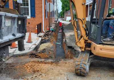 Sewer line replacement compacting fill