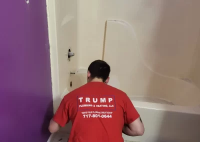 Trump plumber installing shower and tub plumbing